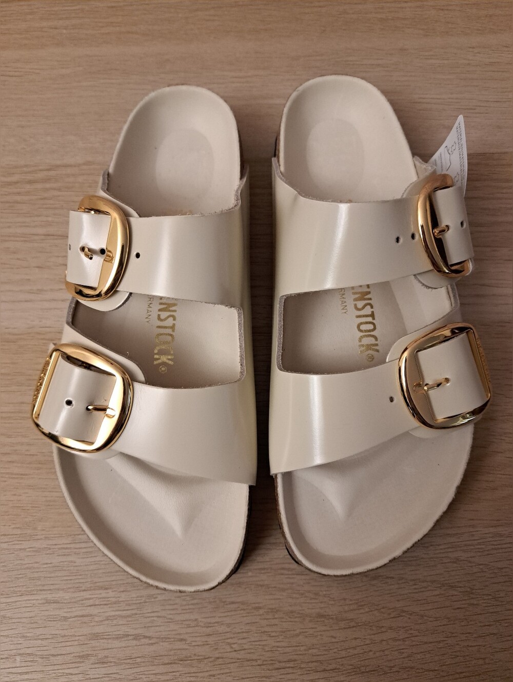 Birkenstock Arizona Big Buckle Sandals in Cream with Gold Buckles.